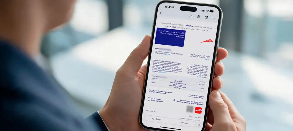 Person reading an RTA email notification about rta vehicle renewal availability in Dubai